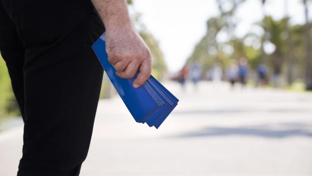 Man holding Flyers